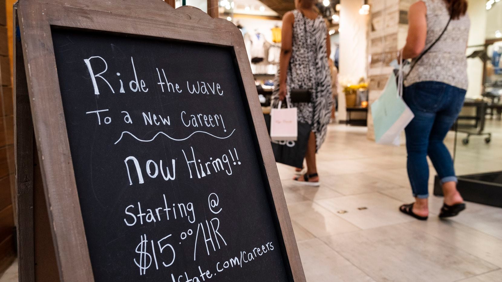 Now hiring sign on display at the store front of "Altar'd State" inside Galleria Dallas.