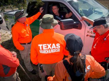 Dawn Keller (in vehicle), West Texas Division Leader of Texas Search and Rescue speaks with...