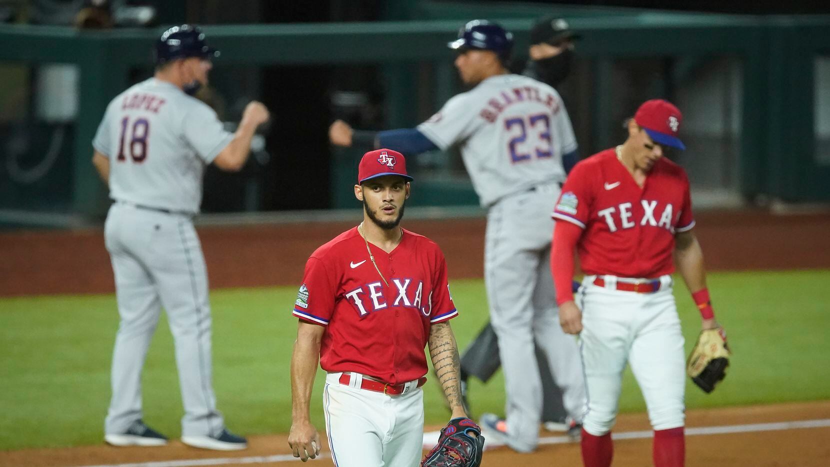 Texas Rangers pitcher Jonathan Hernandez and third baseman Derek Dietrich react after a single by Houston Astros first baseman Yuli Gurriel scored Jose Altuve to give the Astros a 3-2 lead during the eighth inning at Globe Life Field on Friday, Sept. 25, 2020.