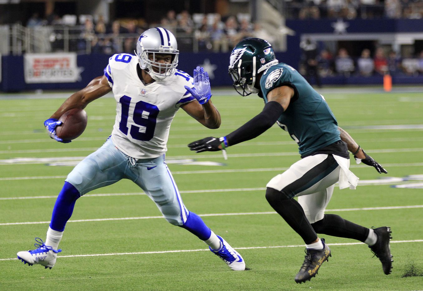 Dallas Cowboys wide receiver Amari Cooper (19) tries to elude a Philadelphia Eagle defender, after a catch, during the first half of a NFL football game at AT&T Stadium in Arlington on Monday, September 27, 2021. (John F. Rhodes / Special Contributor)