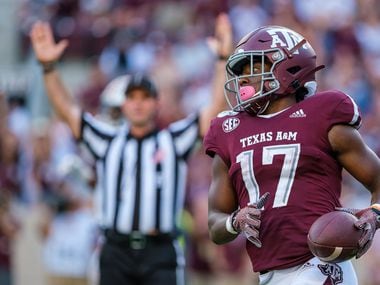 FILE - Texas A&M wide receiver Ainias Smith (17) celebrates after scoring on a 15-yard touchdown reception during the second half of a game against Auburn at Kyle Field on Saturday, Sept. 21, 2019, in College Station.