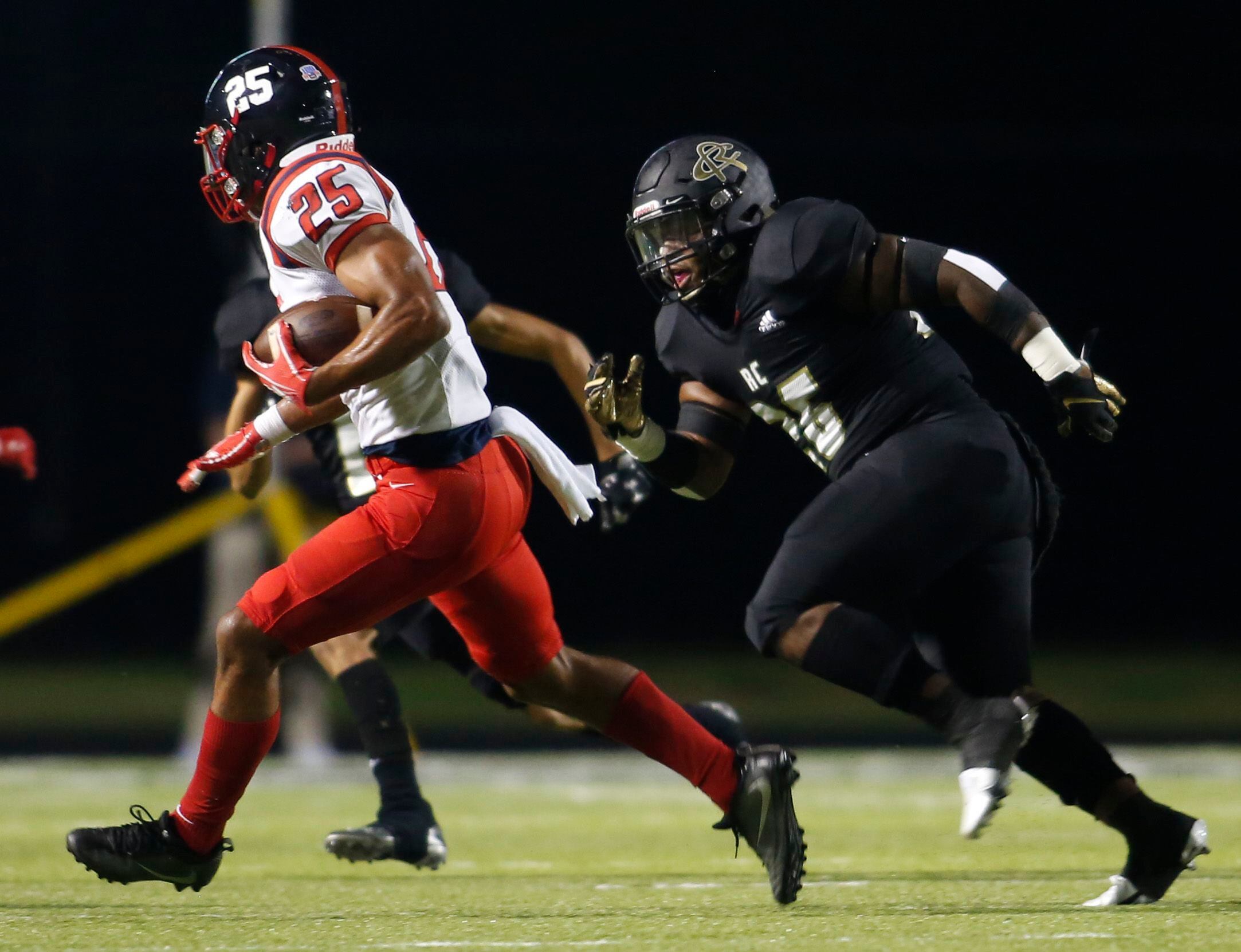 Frisco Centennial running back Jackson Marshall (25) looks for running room as he is pursued...