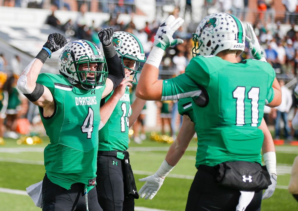 TXHSFB Southlake Carroll senior quarterback Will Bowers (14) and junior Blake Smith celebrate a touchdown by senior running back TJ McDaniel (4) during the first half of a Class 6A Division I area-round playoff high school football game against DeSoto at Newsom Stadium in Mansfield, Saturday, November 24, 2018. (Brandon Wade/Special Contributor)