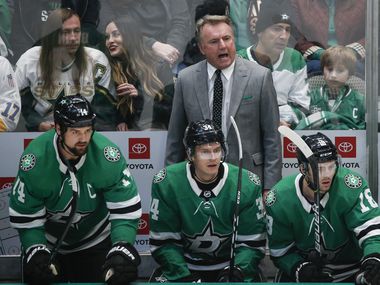 Dallas Stars interim head coach Rick Bowness works the bench during the first period of a National Hockey League match between the Dallas Stars and the New Jersey Devils on Tuesday, Dec. 10, 2019 at American Airlines Center in Dallas. The Stars fired coach Jim Montgomery for “unprofessional conduct” on Tuesday morning, ending his second season behind the bench. The team failed to disclose exactly why Montgomery was dismissed.