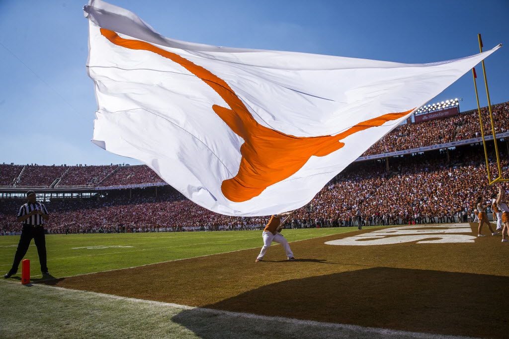 A Longhorn flags is waved on the field after a 3-yard touchdown run by quarterback Tyrone...