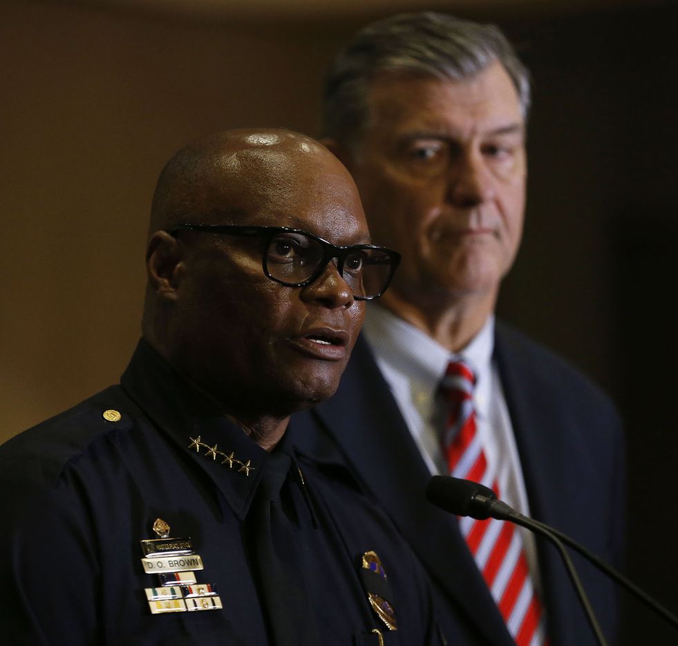 Dallas Police Chief David Brown and Dallas Mayor Mike Rawlings speak at a press conference...