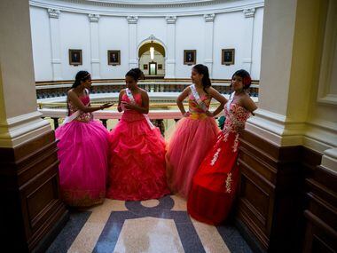 Leslie Abraham, Alesandra Lopez, Julia Pierce and Isabel Pierce wait to enter a senator's...