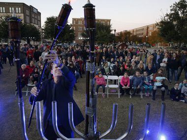 The menorah is lighted during a ceremony hosted by Chabad of Frisco at Frisco City Hall in...