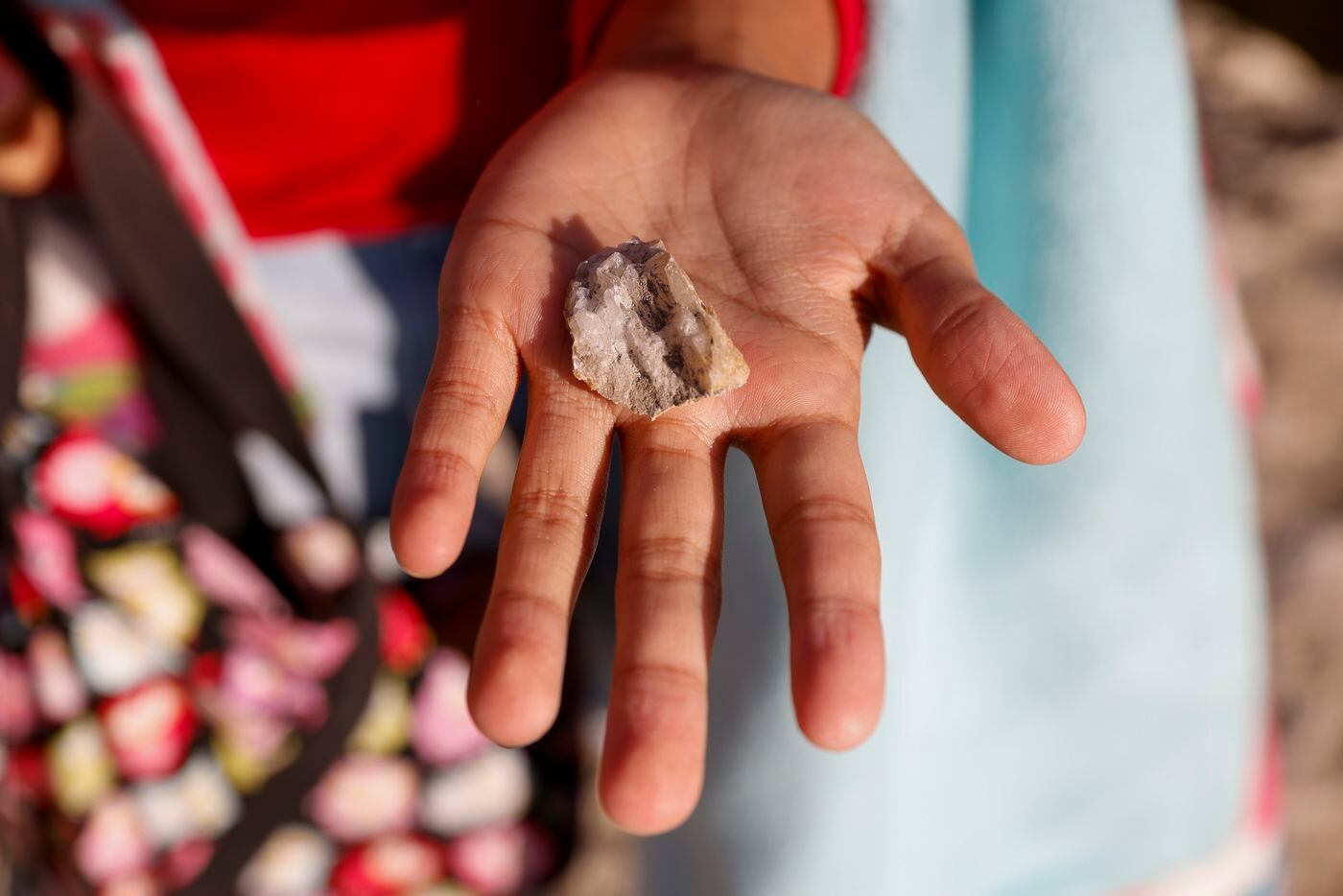 Catalina Koontz, 7, shows off a piece of quartz she found on the Ladd property in...