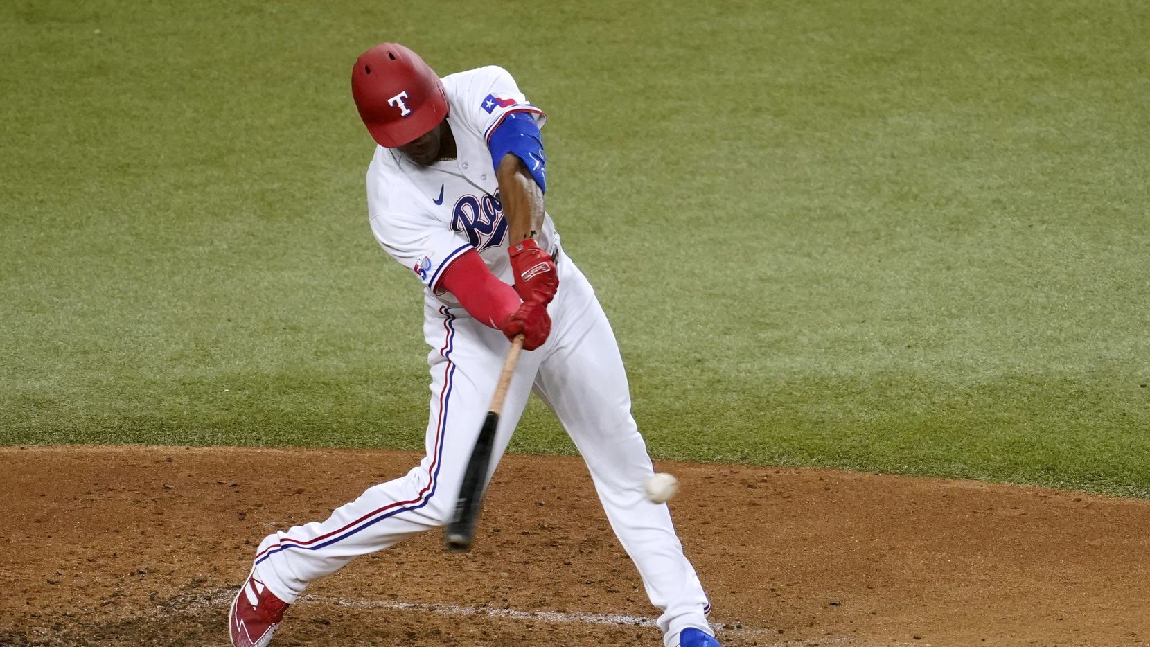 Texas Rangers' Elier Hernandez hits a single against the Seattle Mariner during the second...