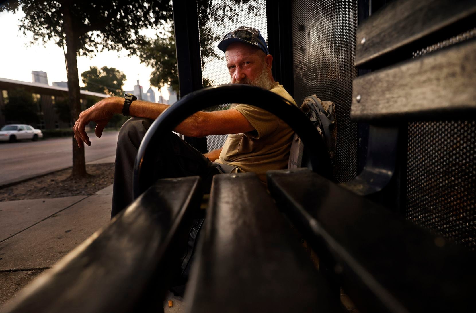 David Barger, who said he had been homeless since the beginning of the year, spend’s the night in a DART bus stop on Malcom X Boulevard near downtown Dallas in August. In addition to enduring the summer heat on the streets, he lived outdoors during the February freeze, he said.