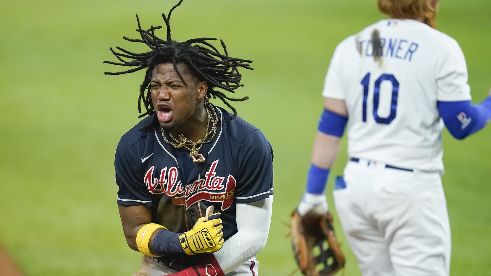 Atlanta Braves right fielder Ronald Acuna Jr. celebrates after advancing from first to third...