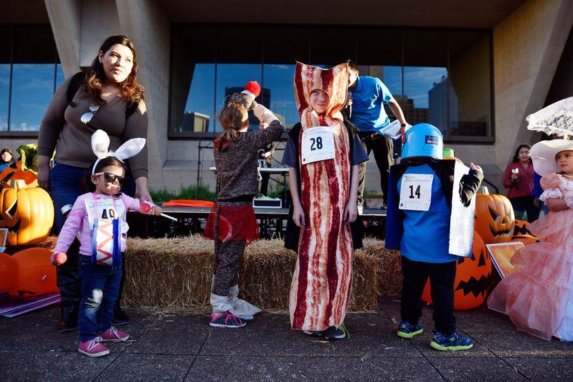 Kids model costumes during Pumpkins on the Plaza at Dallas City Hall. 