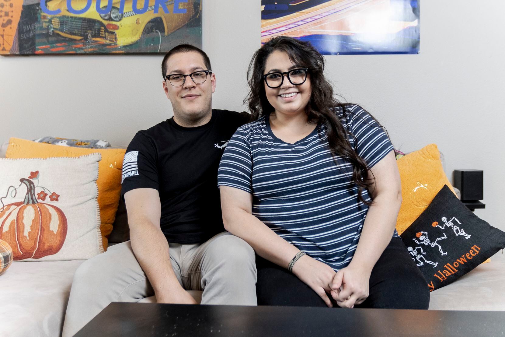Emilio Aguinaga and Heather Carrillo pose for a portrait at their apartment in Dallas,...