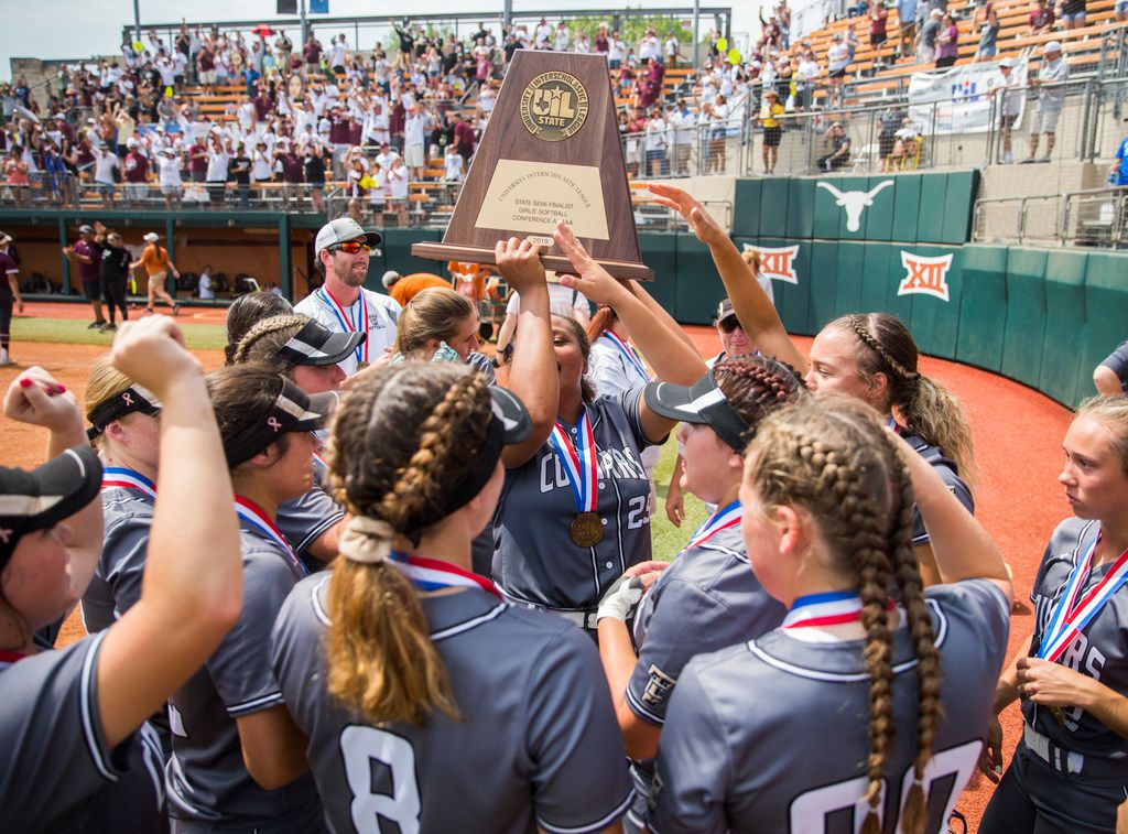 The Colony softball players hold up a state semifinalist trophy after they lost 5-1 in a UIL Class 5A state semifinal softball game between The Colony and Corpus Christi Calallen on Friday, May 31, 2019 at Red & Charline McCombs Field at the University of Texas in Austin. (Ashley Landis/The Dallas Morning News)