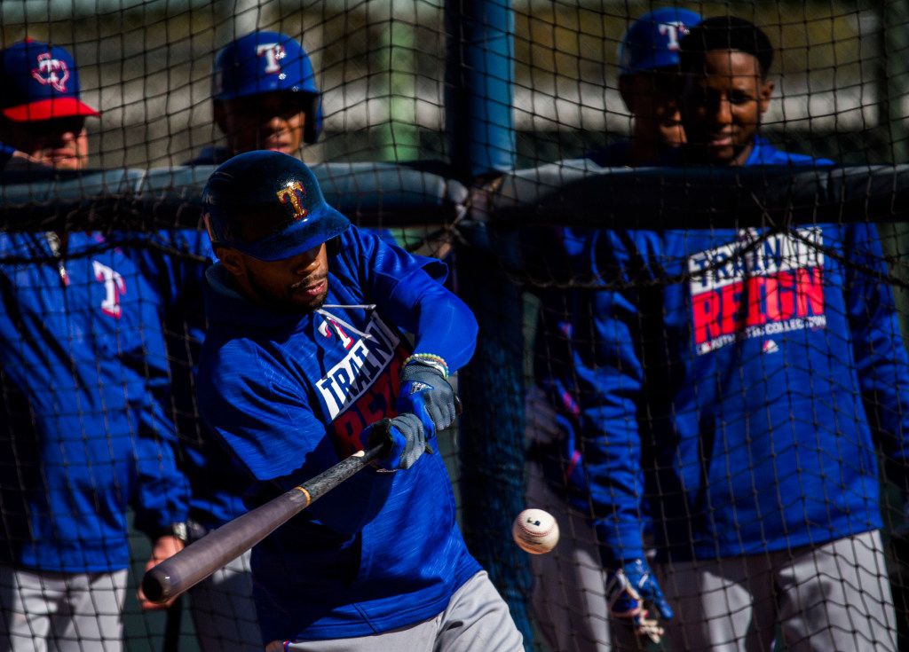 Texas Rangers center fielder Delino DeShields (3) bats during a spring training workout at...