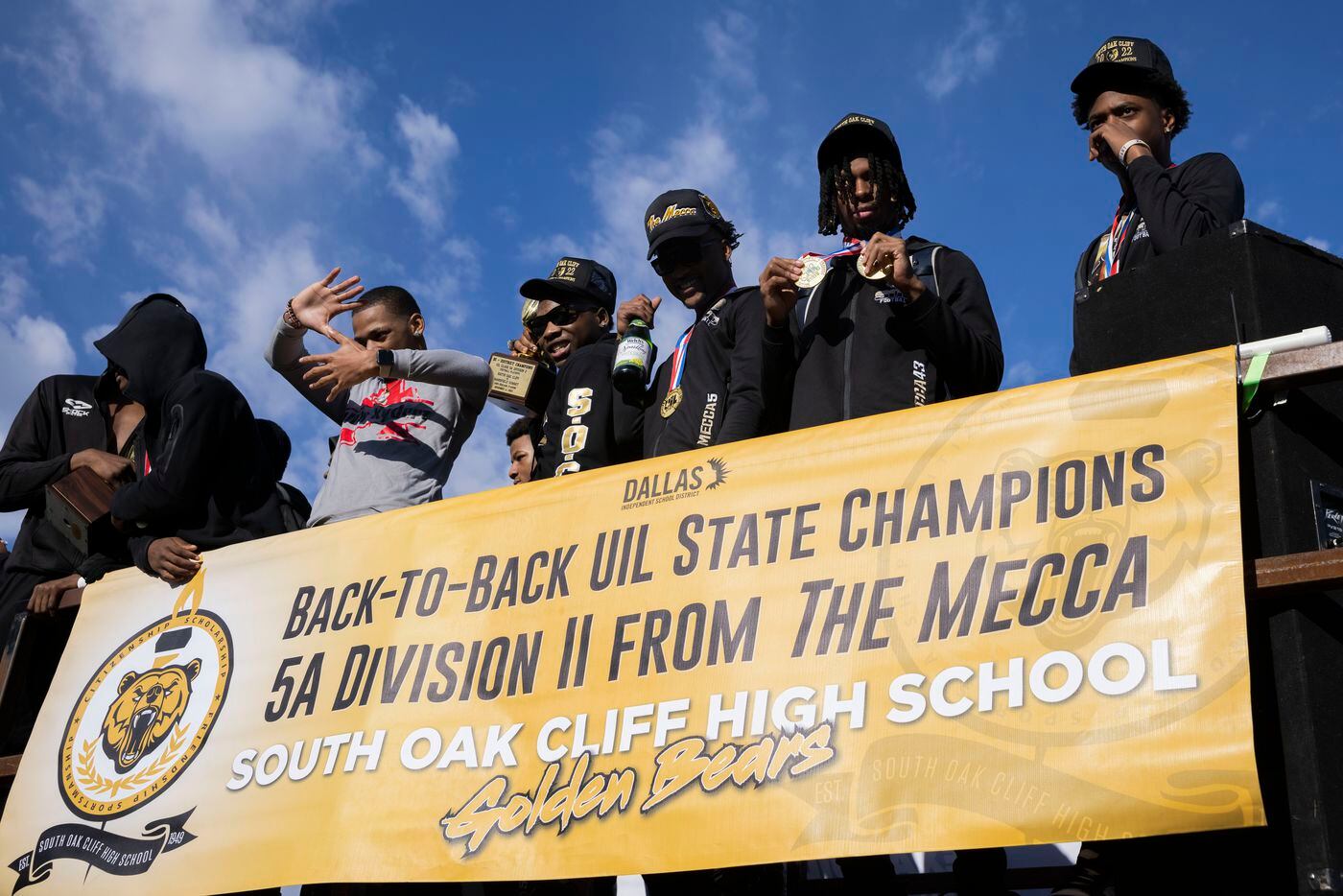 The South Oak Cliff Golden Bears stand on a float before their class 5A parade...