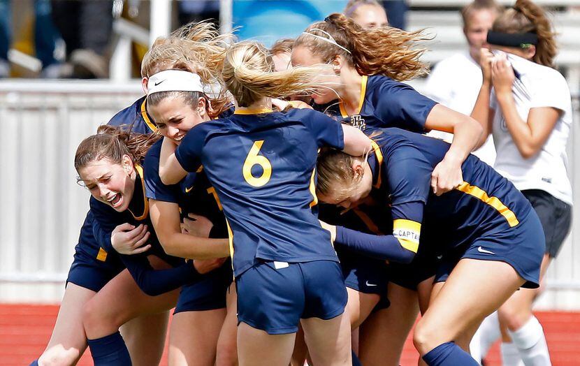 The Highland Park High School girls soccer team celebrates a 2-1 victory over Frisco...