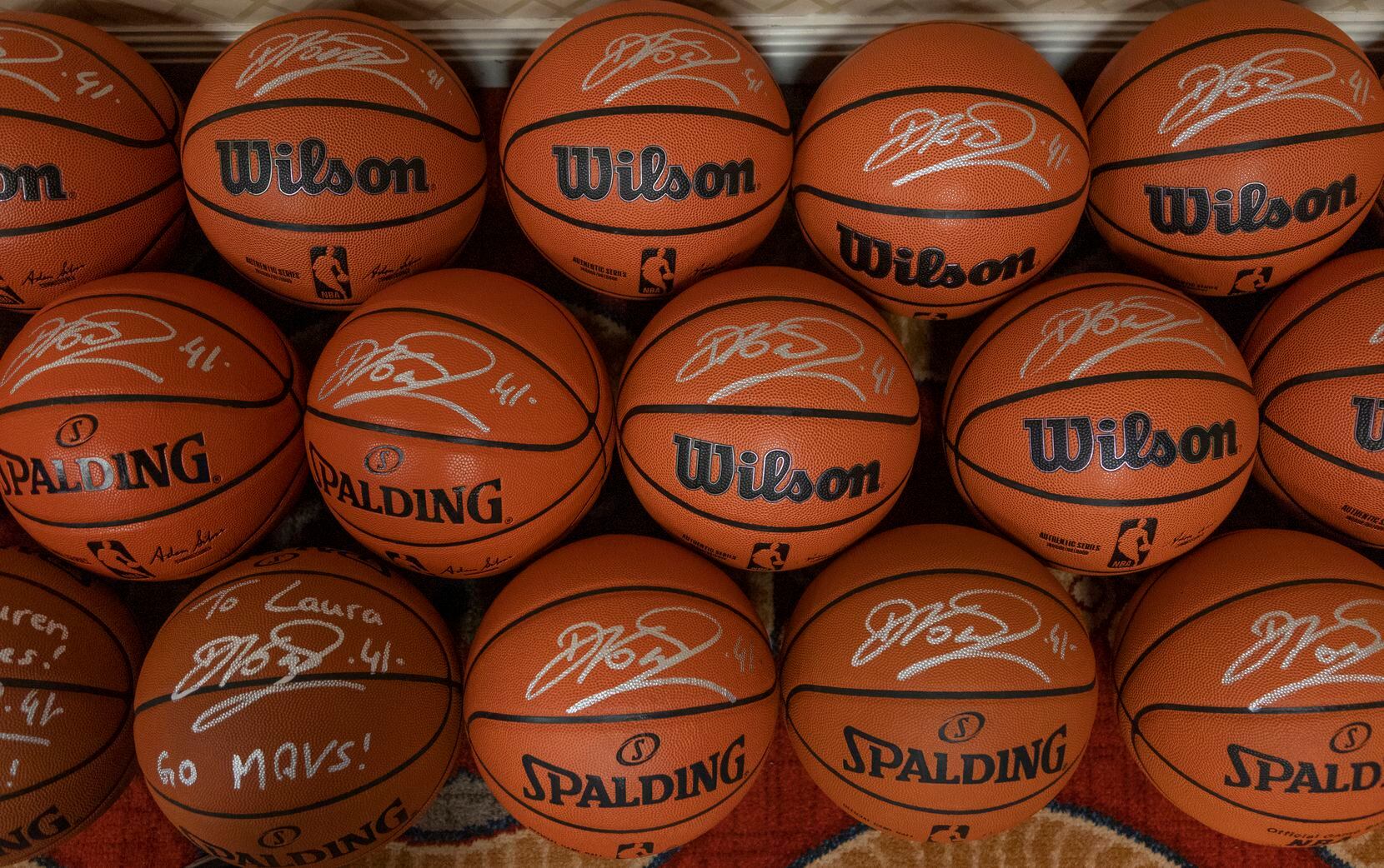 Former Dallas Mavericks player Dirk Nowitzki autographed dozens of  basketballs before...