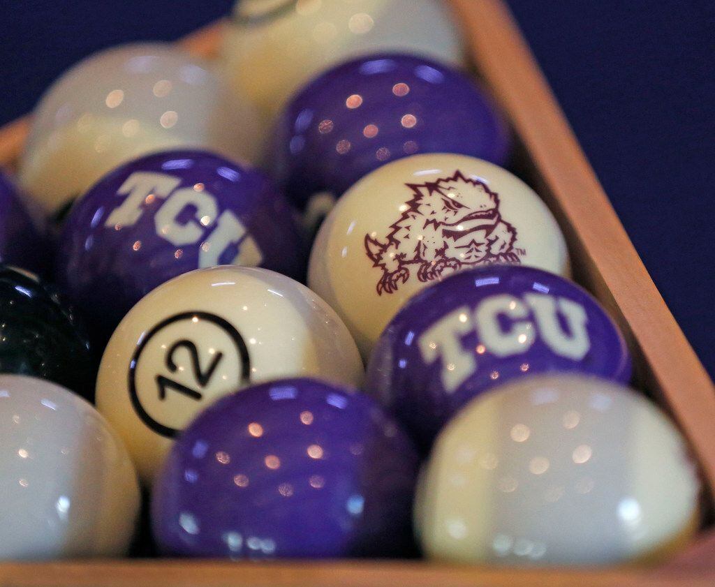 The billiard balls are emblazoned with TCU imagery on the pool table in TCU head football coach Gary Patterson's  home office/recruiting room at his residence in Fort Worth, Texas on Wednesday, July 5, 2018. (Louis DeLuca/The Dallas Morning News)