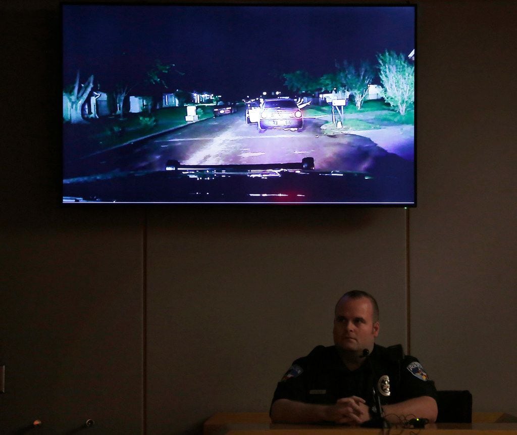 Balch Springs police Officer Jeremy Chamblee sits while the jury watches his dash-camera video during the third day of the trial of fired Balch Springs police Officer Roy Oliver, who is charged with murder in the death of 15-year-old Jordan Edwards. 