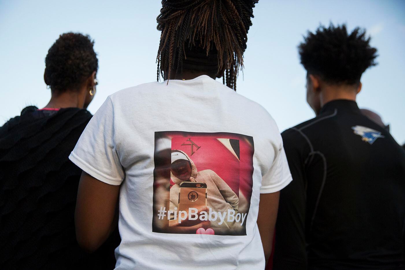 Ashuntae Coleman, 14, wears a t-shirt in memory of her childhood friend during the ...