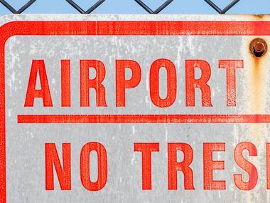 A sign marks the property line for the Dallas Executive Airport on Sunday, Nov. 13, 2022,...