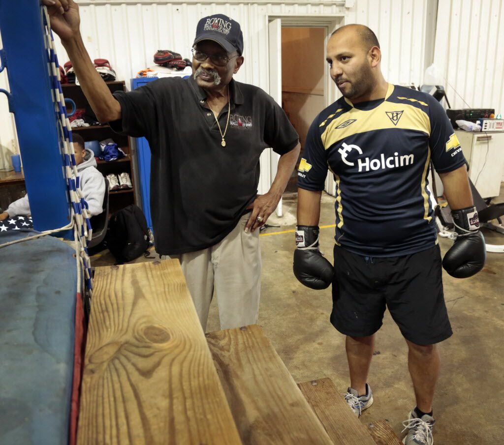 Curtis Cokes. 76, as former boxing champion from Dallas, Texas, talks to boxer Alberto Baez,  at his gym on June 06,  2013. Baez has trained with Cokes since 1996 and credits him with saving his life by giving him focus.  