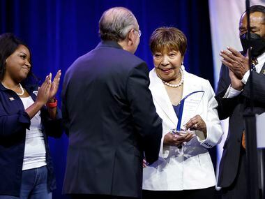 Outgoing U.S. Representative Eddie Bernice Johnson of Dallas (center) is recognized with the...