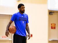 Dallas Mavericks guard Kyrie Irving participates in a team practice on Tuesday, Feb. 7,...