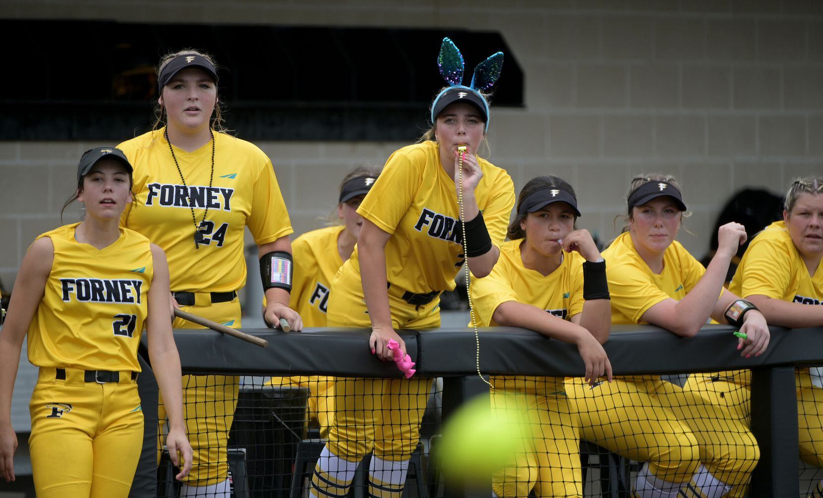 Forney players watch as a ball is hit into play during game 3 of a Class 5A Region II...