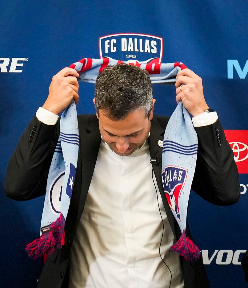 New FC Dallas head coach Nico Estévez dons a team scarf during his introductory press conference at the National Soccer Hall of Fame on Friday, Dec. 3, 2021, in Frisco, Texas.
