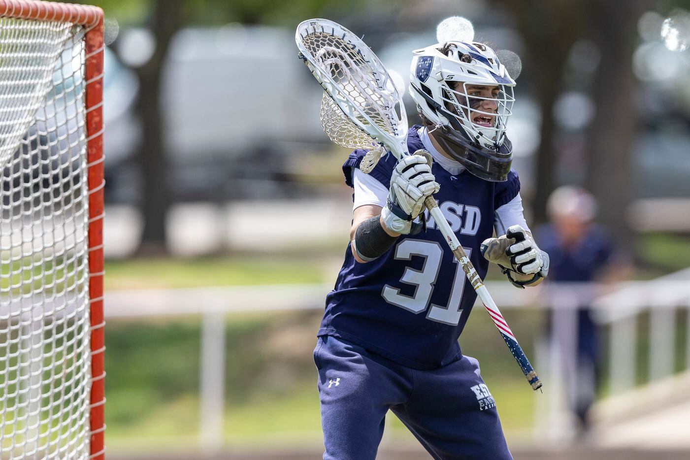 Episcopal School of Dallas goalie Jack Scott calls out to his teammates as they compete...