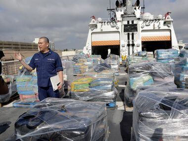 Pallets containing more than 26 tons of cocaine worth at least $715 million sit on the...