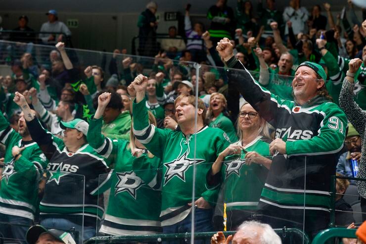 Fans cheer after a goal by Dallas Stars center Logan Stankoven during the second period of...