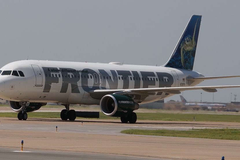 A Frontier Airlines A320 taxis at DFW International Airport.