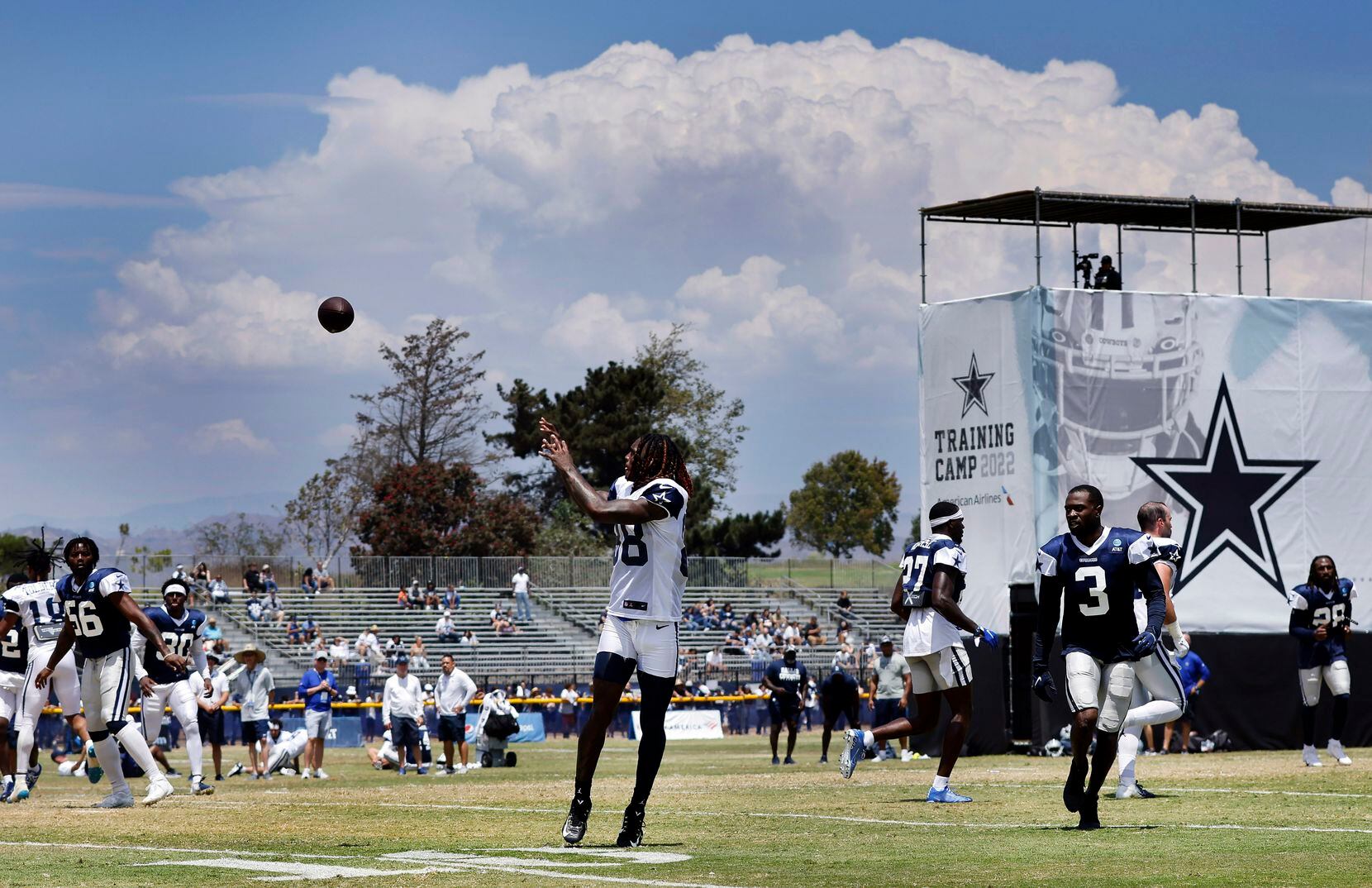 Dallas Cowboys wide receiver CeeDee Lamb (88) receives a soft pass at the end of training...