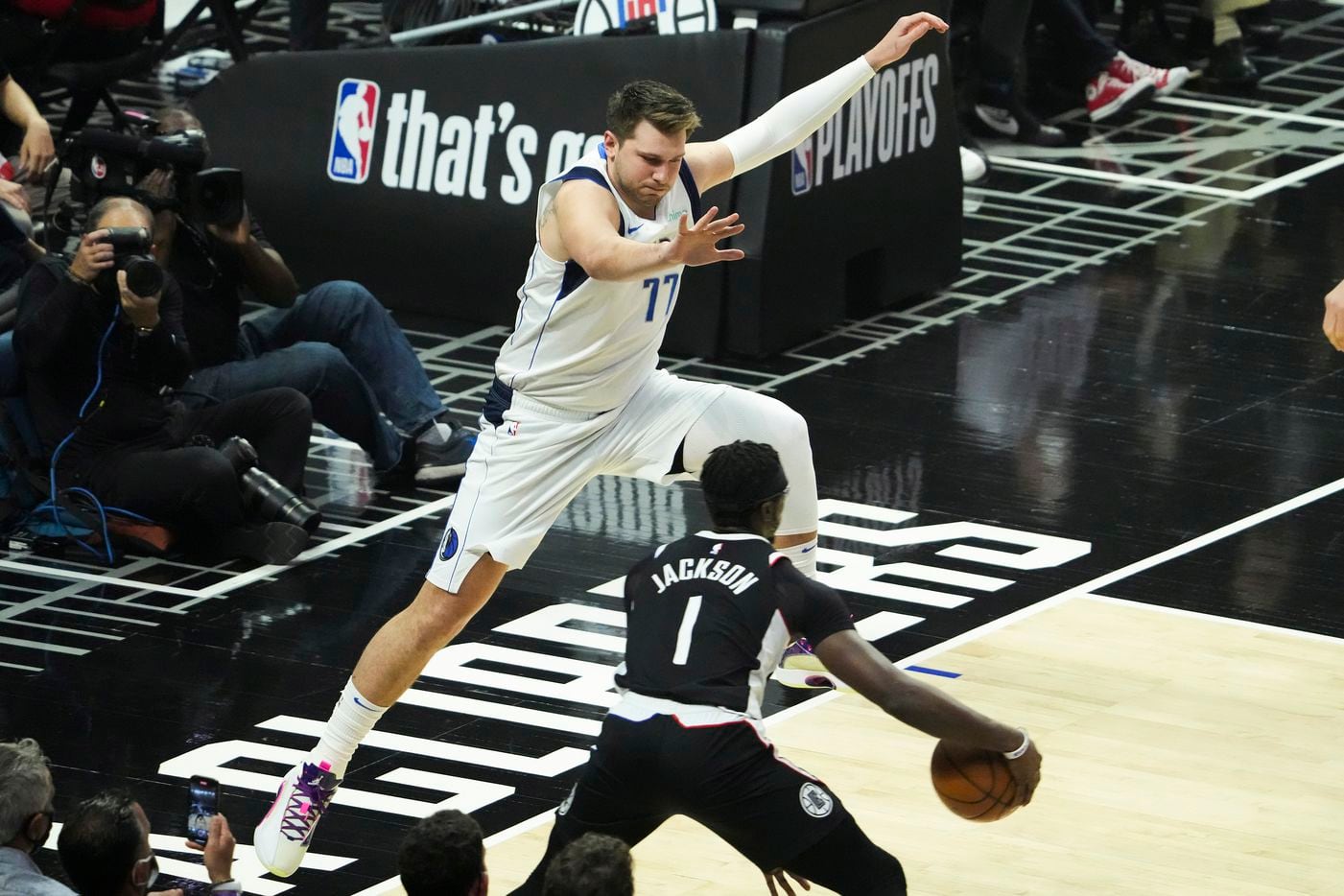 Dallas Mavericks guard Luka Doncic (77) defends against LA Clippers guard Reggie Jackson (1)...