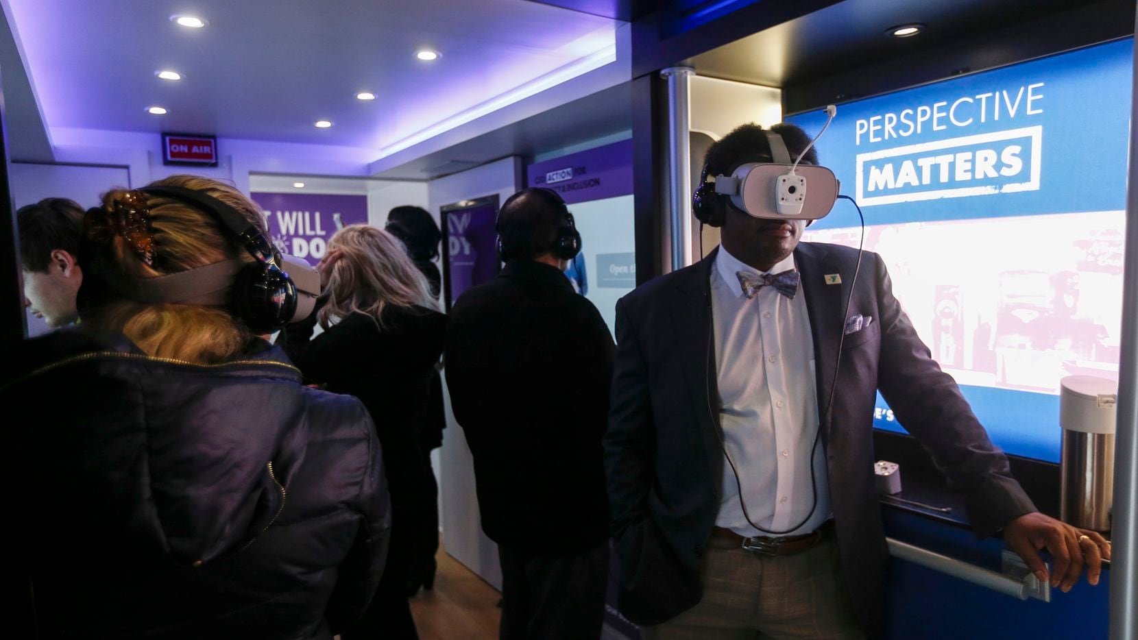 Employees use virtual reality devices to experience bias scenarios as they participate in...