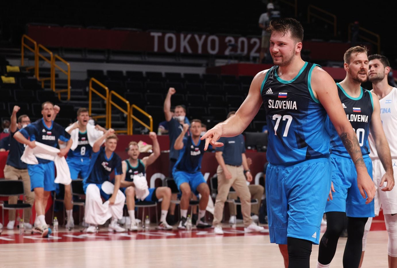 Slovenia’s Luka Doncic (77) signals a made basket after he was fouled on a basket in the first half of play against Argentina during the postponed 2020 Tokyo Olympics at Saitama Super Arena on Monday, July 26, 2021, in Saitama, Japan. Slovenia defeated Argentina 118-100. (Vernon Bryant/The Dallas Morning News)