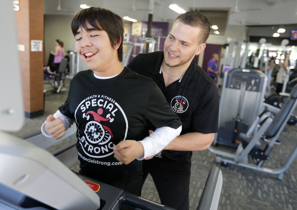 Alfredo Benitez (left) works out with Daniel Stein at Anytime Fitness in McKinney. Stein is owner of Special Strong, which helps special needs individuals find strength and purpose through exercise. 