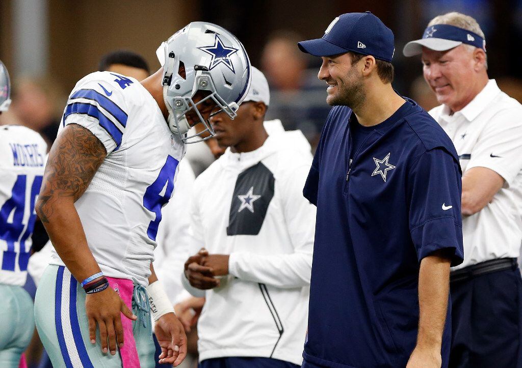 ARLINGTON, TX - OCTOBER 09:   (L-R) Dak Prescott #4, quarterback of the Dallas Cowboys talks...