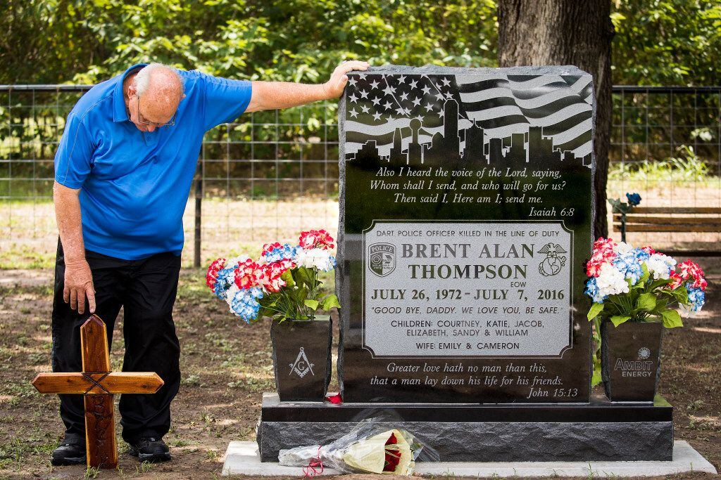Sam Thompson visits the grave of his son, DART police Officer Brent Thompson. The grave is...