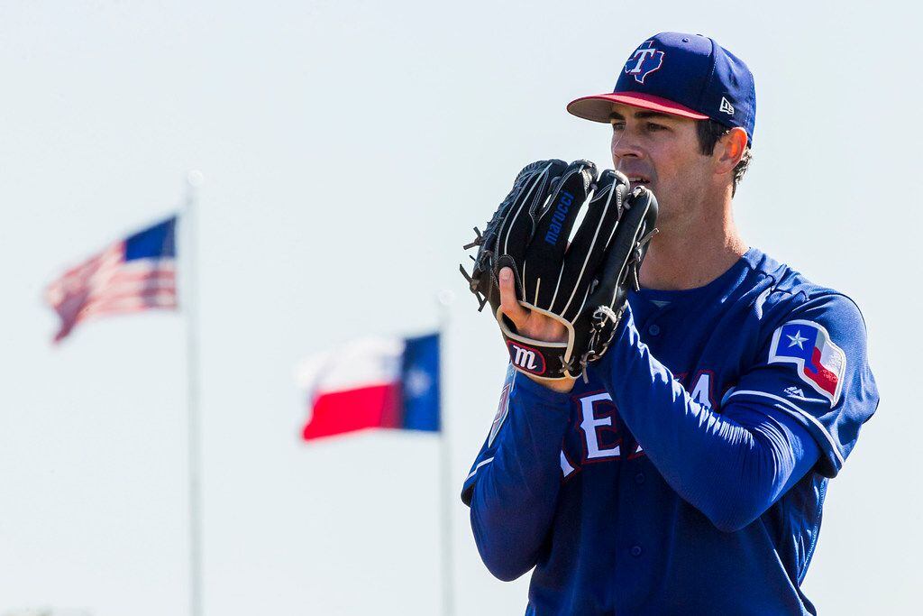 Texas Rangers pitcher Cole Hamels throws live batting practice during a spring training...