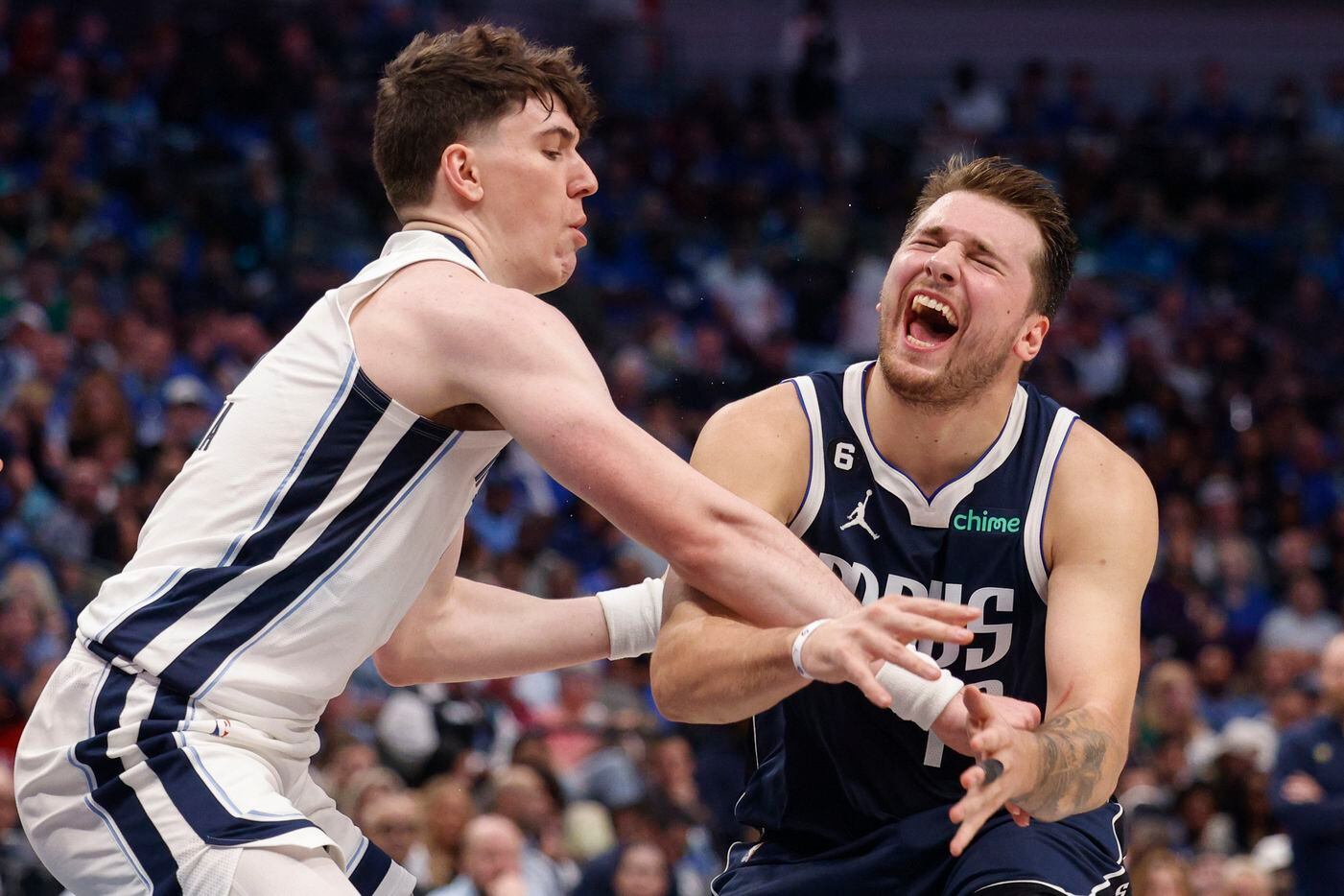 Dallas Mavericks guard Luka Doncic (77) reacts after being fouled by Memphis Grizzlies...