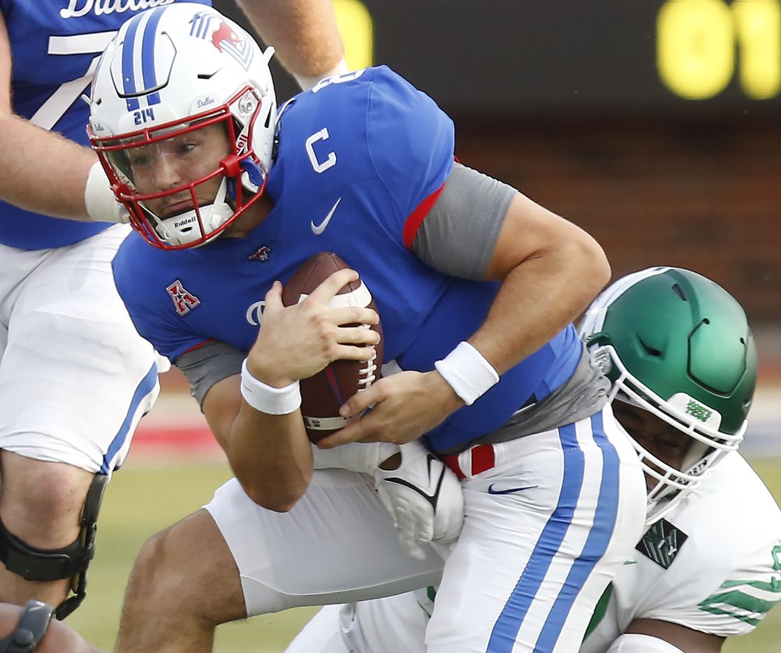 Southern Methodist Mustangs quarterback Tanner Mordecai (8) is tackled by North Texas Mean Green defensive lineman Dion Novil (97) during the first half as SMU hosted UNT at Ford Stadium in Dallas on Saturday, September 11, 2021. (Stewart F. House/Special Contributor)