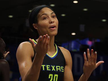 Dallas Wings forward Isabelle Harrison (20) pleads her case to a game official after a...