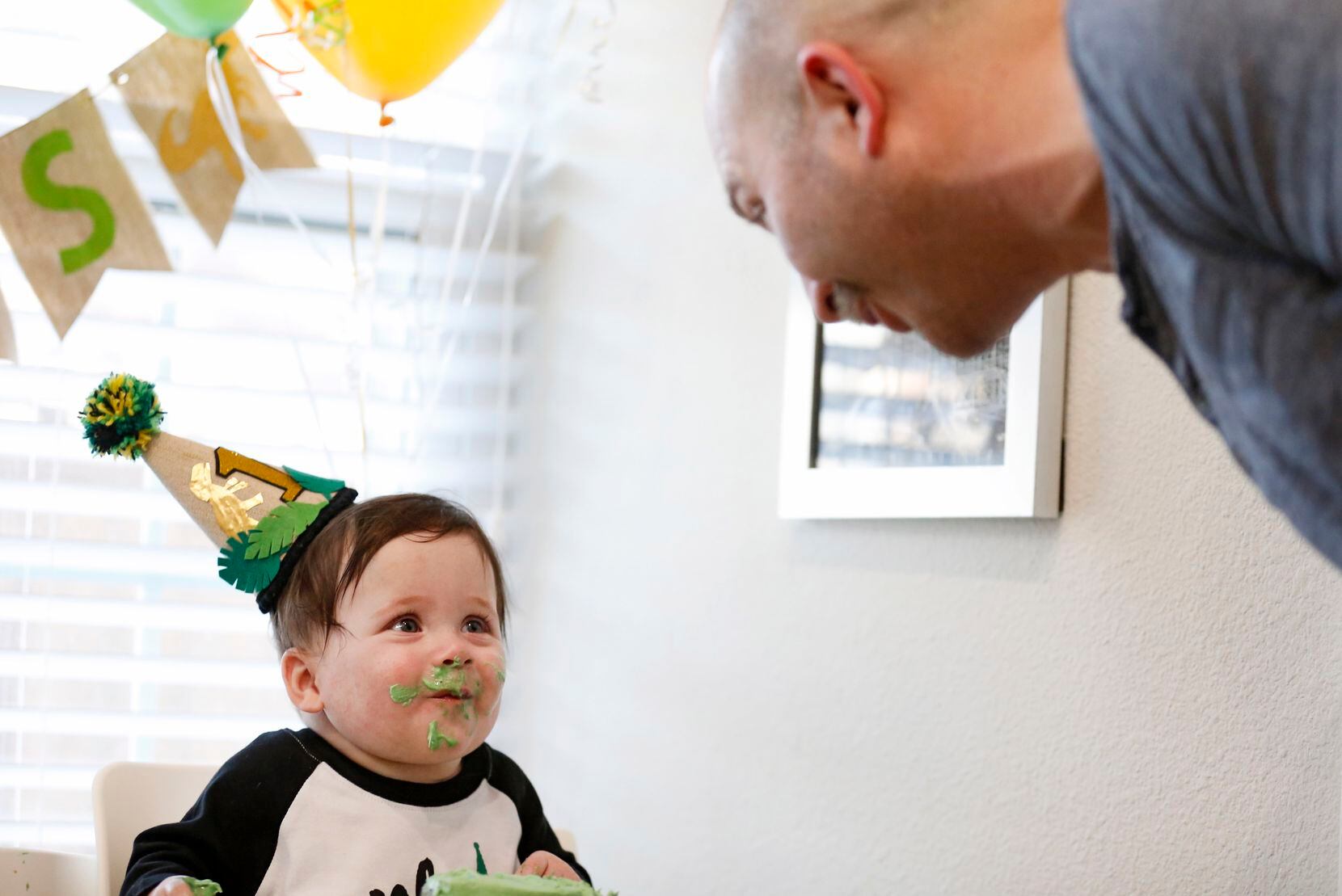Hudson smiled at his father, Chris Marr, while having cake at the quads’ first birthday party in March at the family’s home.