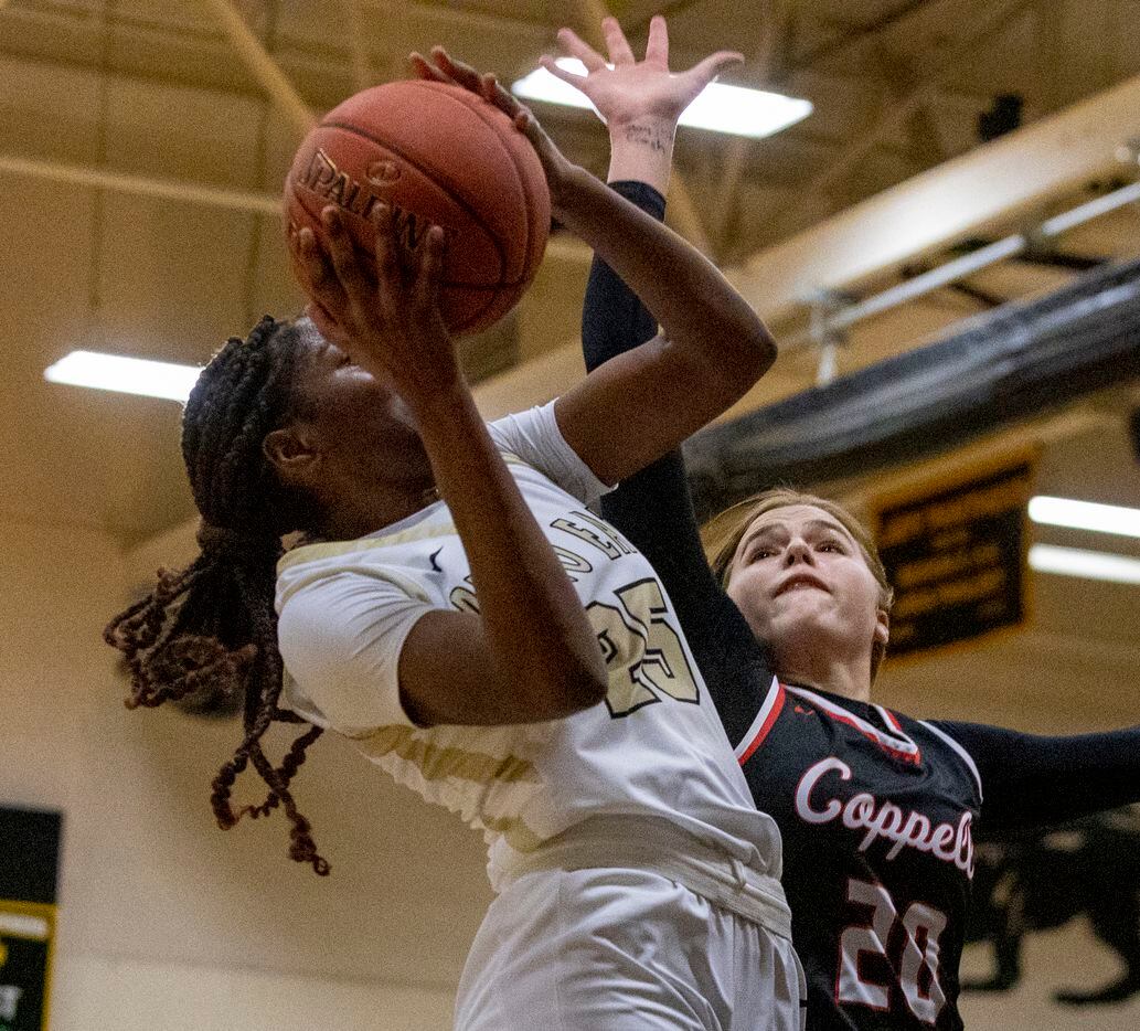 Plano East High School Ada Anamekwe (25) jumps to shoot the ball as Coppell High School...
