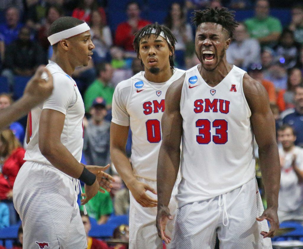SMU forward Semi Ojeleye (33) reacts to a good offensive play as teammates Jarrey Foster...